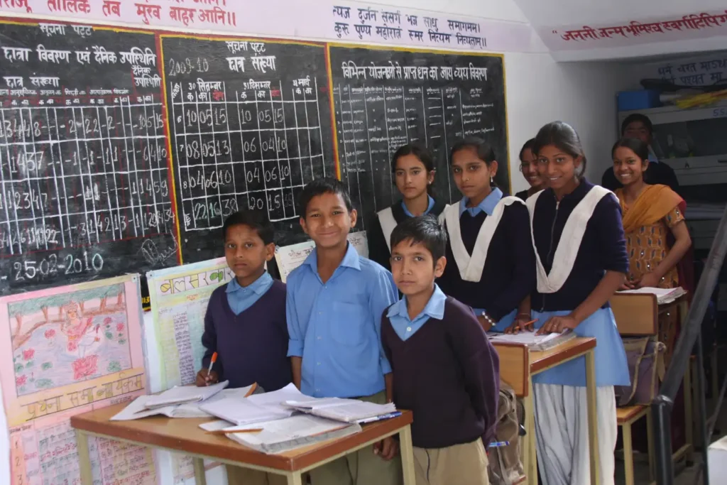 Volunteers working with students